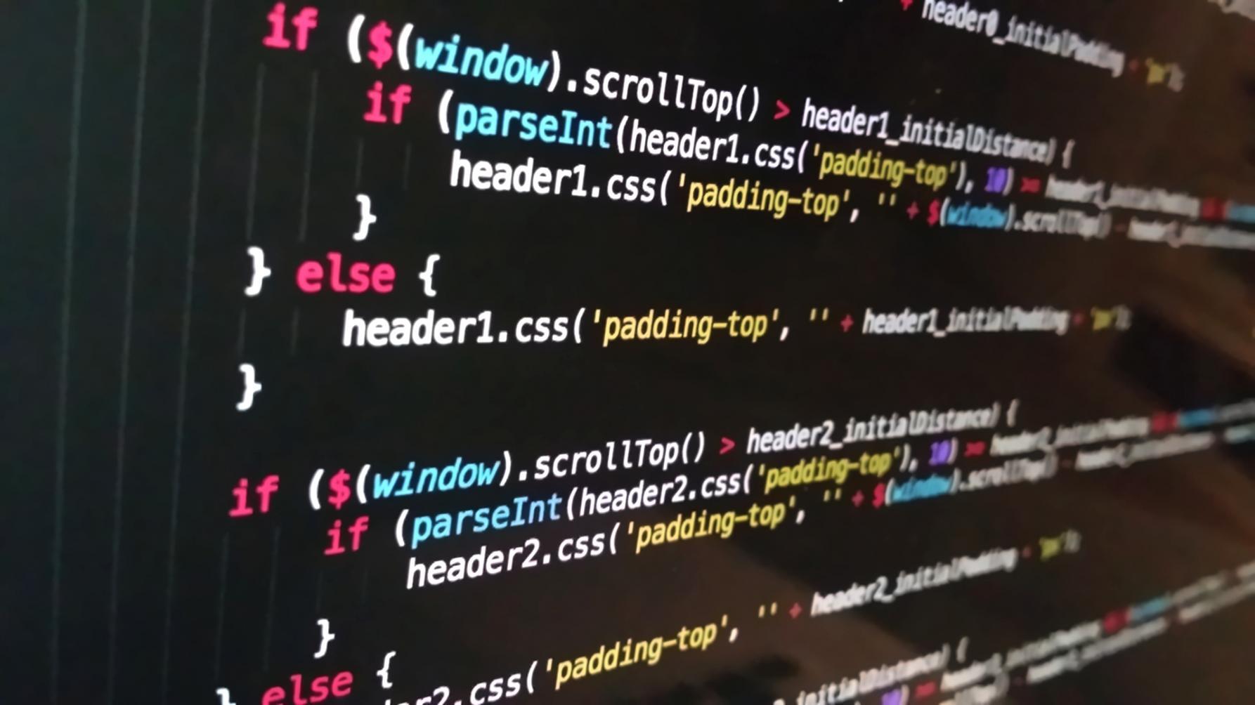 Game development workspace showing code editor and mobile game interface